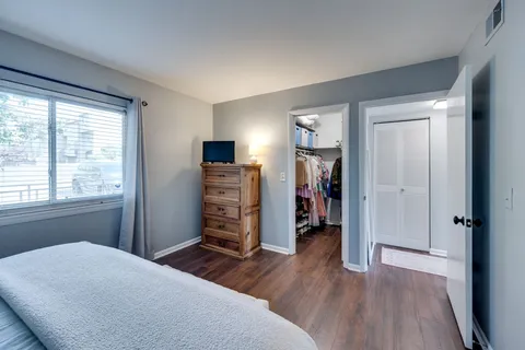 a room with a bed and a window