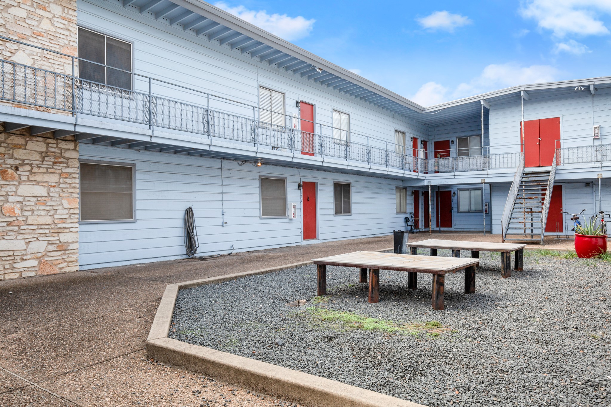 2408 Longview Street, Unit 112 Austin, TX 78705 - Photo 15 of 15 a view of a house with a porch and furniture