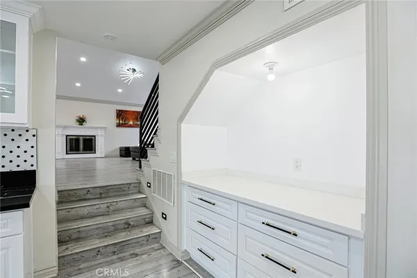 a view of entryway and hall with wooden floor