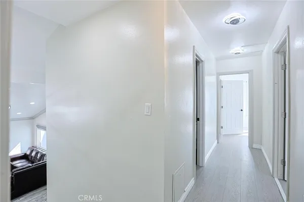 a view of a livingroom with wooden floor