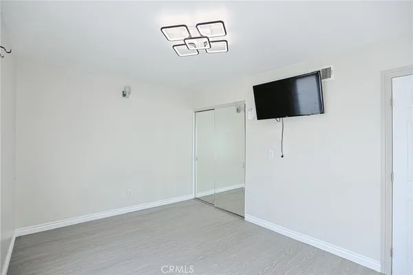 a bathroom with a shower and mirror