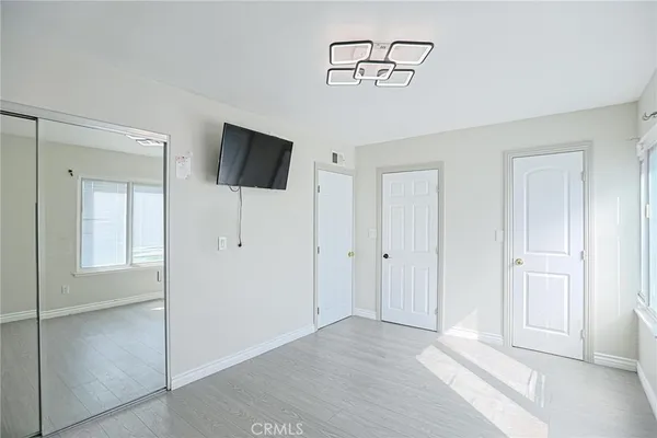 a bathroom with a toilet a sink and a mirror