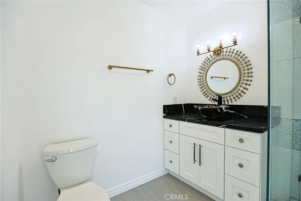 a bathroom with a shower and mirror
