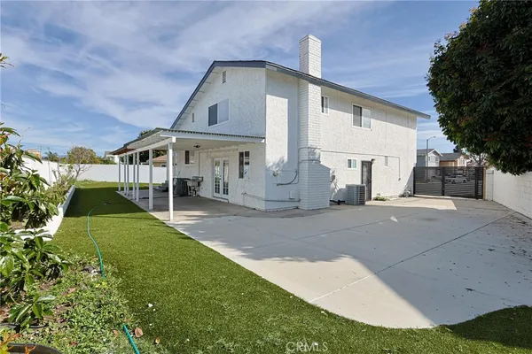 a view of a porch with a table and chairs
