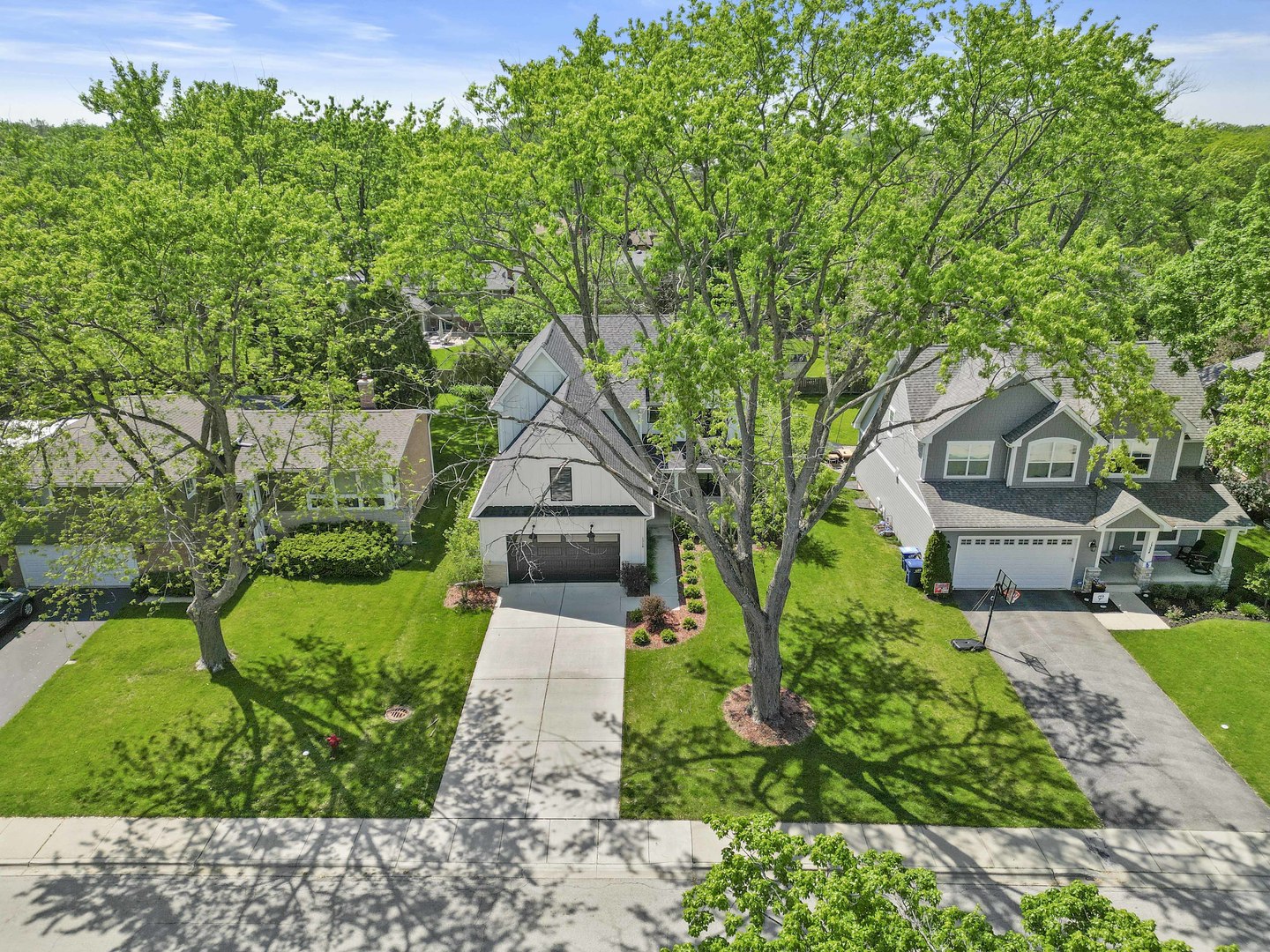 1318 Kenton Road Deerfield, IL 60015 - Photo 2 of 56 a front view of a house with garden