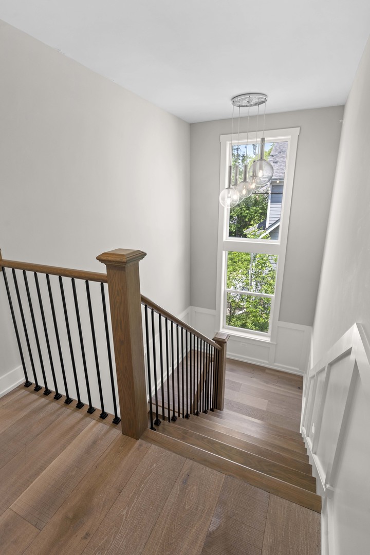 1318 Kenton Road Deerfield, IL 60015 - Photo 24 of 56 a view of a room with wooden floor and windows