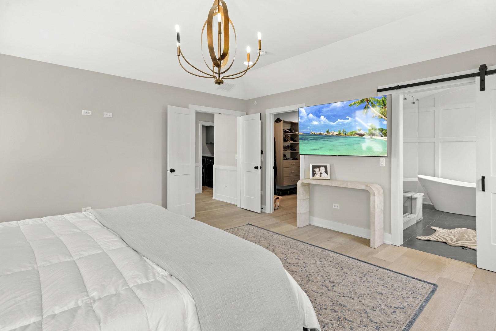 1318 Kenton Road Deerfield, IL 60015 - Photo 26 of 56 a spacious bedroom with a bed and a flat screen tv