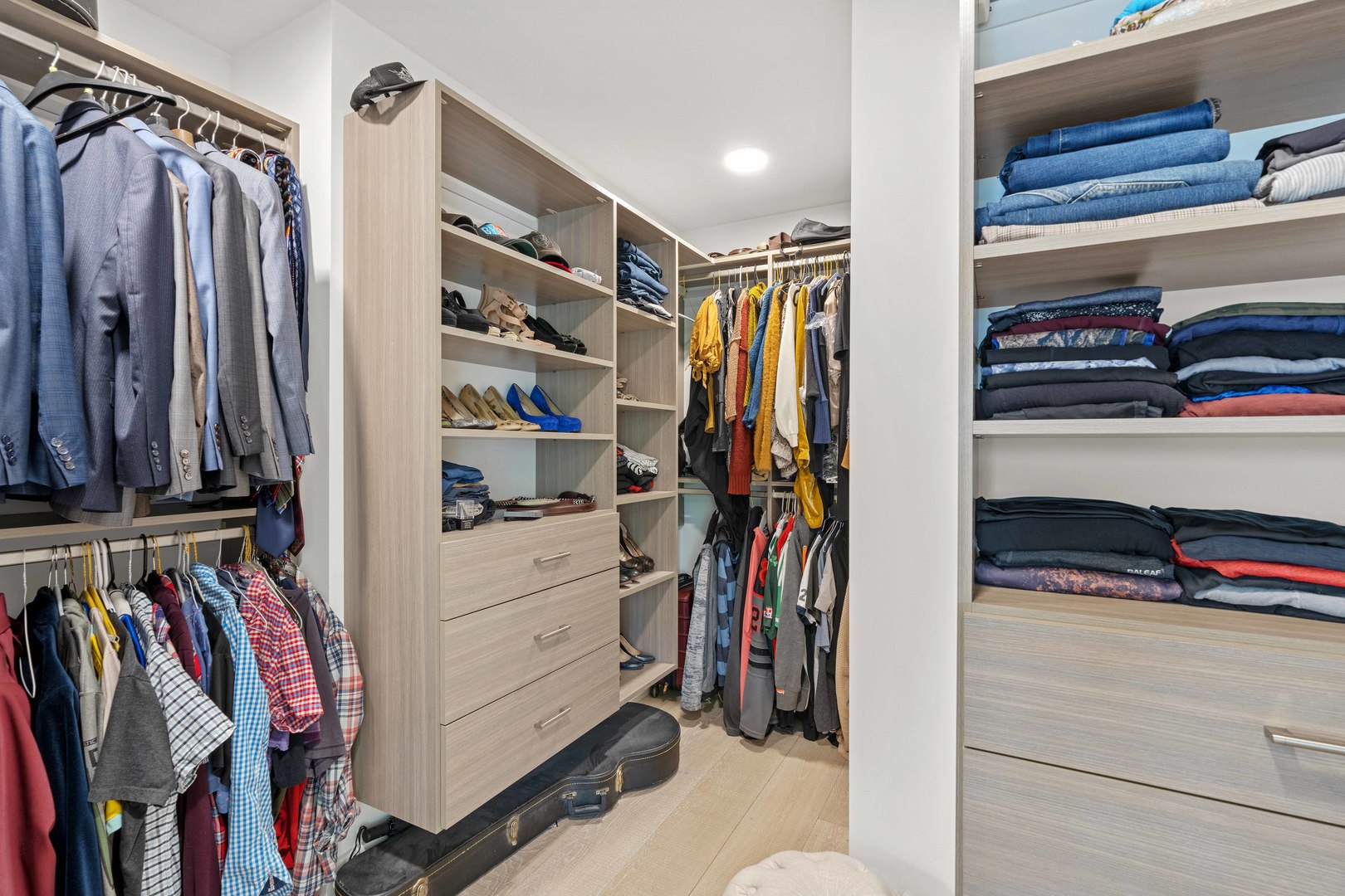 1318 Kenton Road Deerfield, IL 60015 - Photo 27 of 56 a view of walk in closet with clothes and shoes