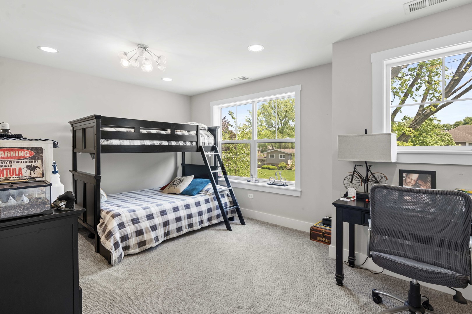 1318 Kenton Road Deerfield, IL 60015 - Photo 32 of 56 a bedroom with a bed and a chandelier