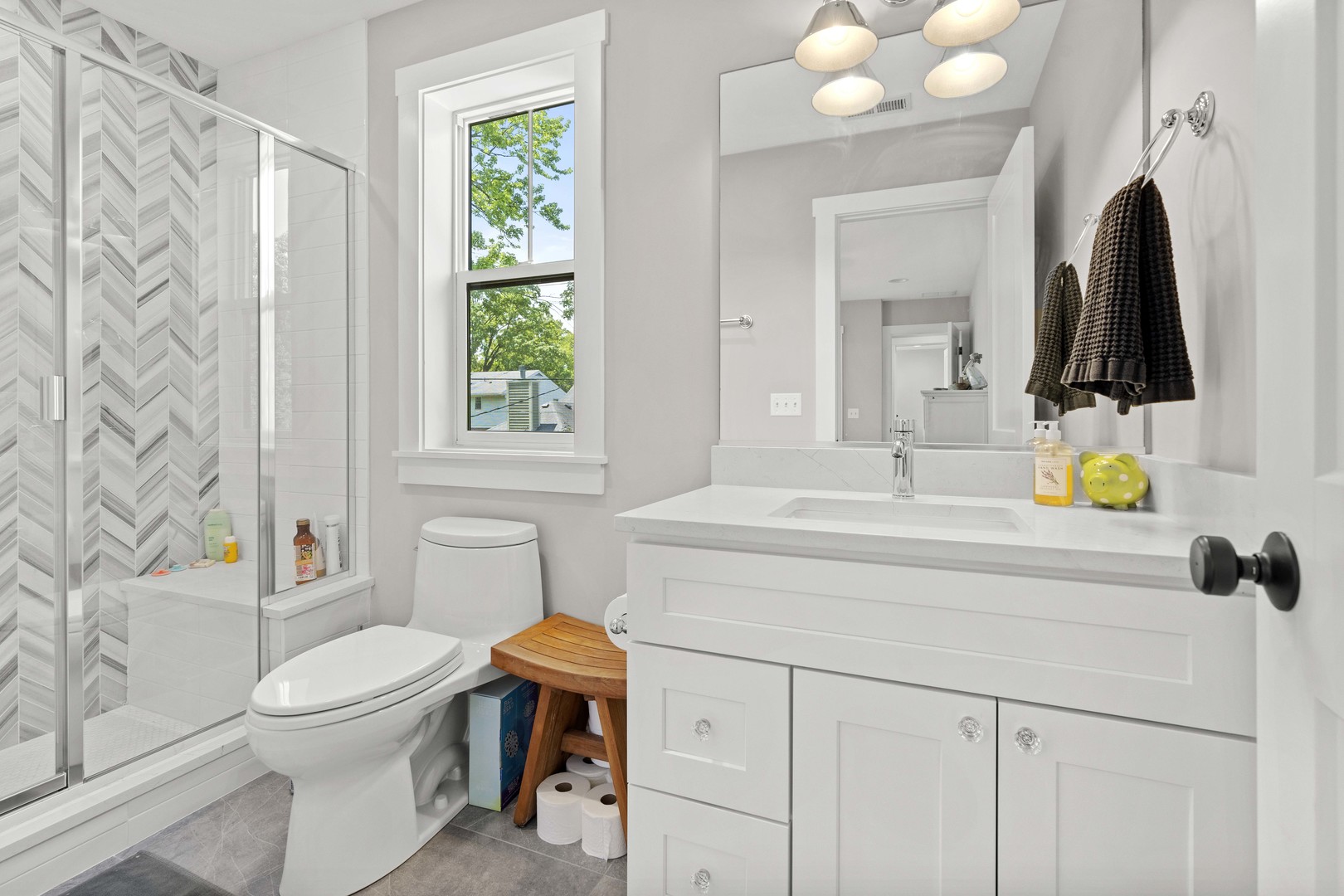 1318 Kenton Road Deerfield, IL 60015 - Photo 38 of 56 a bathroom with a sink toilet and shower