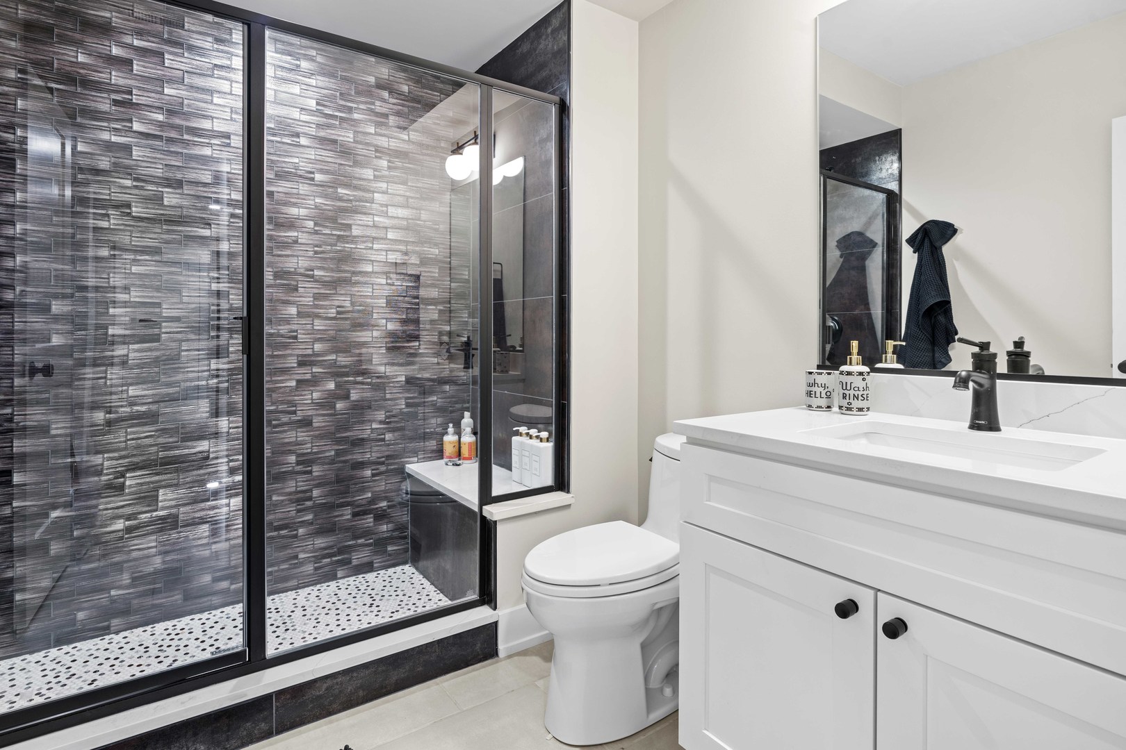 1318 Kenton Road Deerfield, IL 60015 - Photo 43 of 56 a bathroom with a sink a toilet and shower