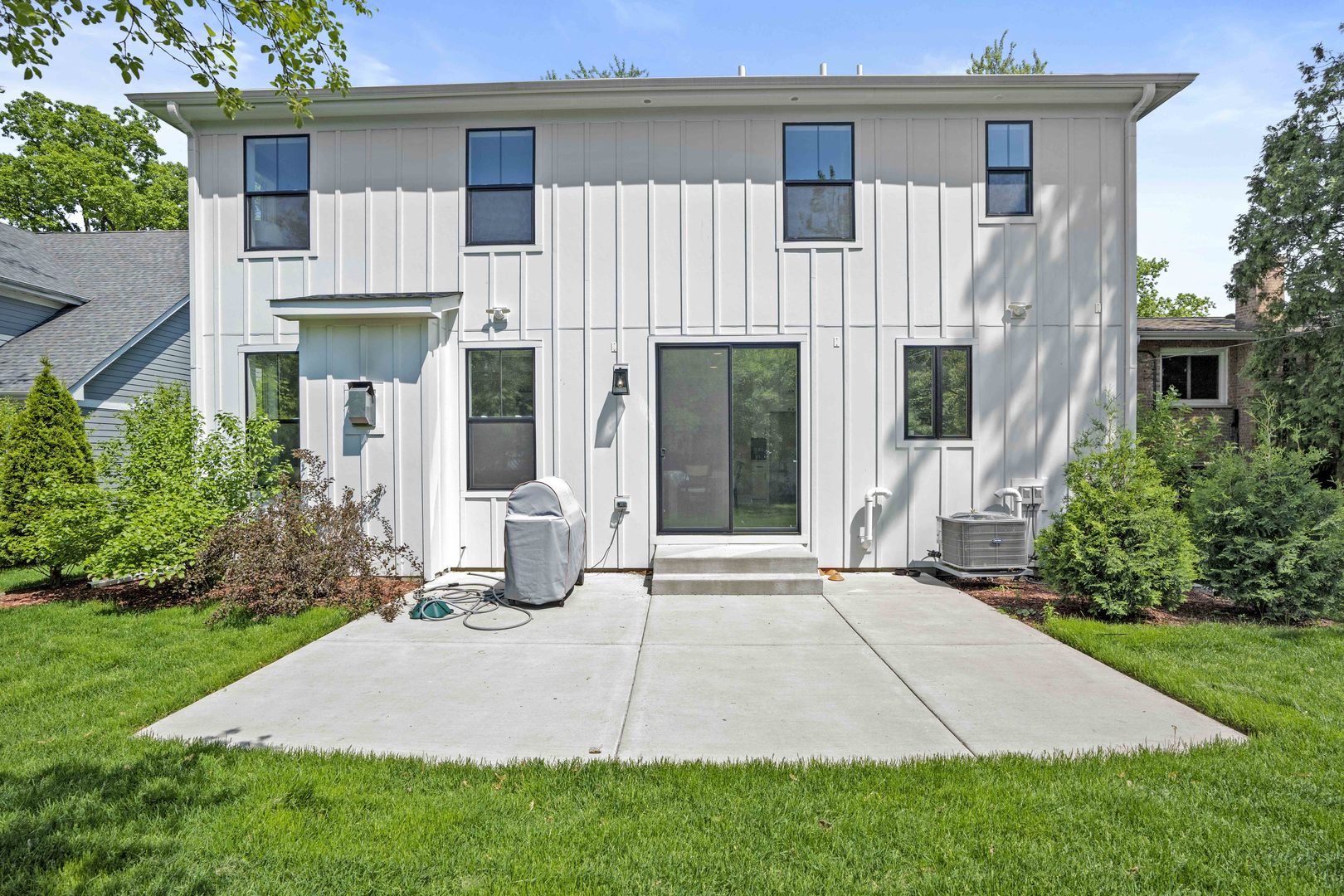 1318 Kenton Road Deerfield, IL 60015 - Photo 47 of 56 a front view of a house with garden