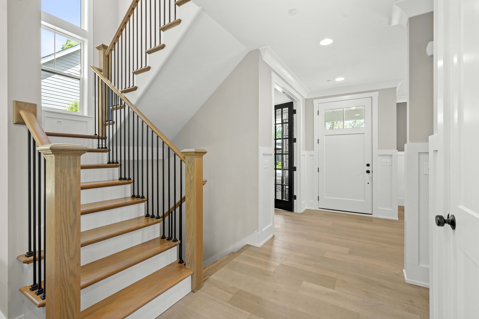 1318 Kenton Road Deerfield, IL 60015 - Photo 5 of 56 a view of entryway with wooden floor and stairs