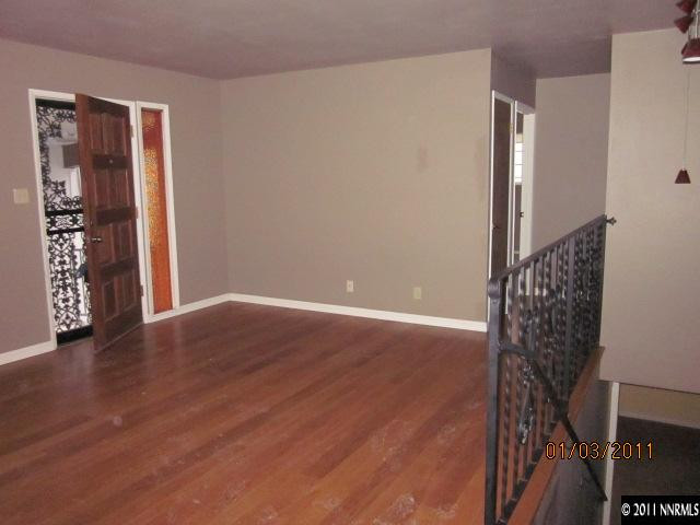 2090 Keystone Avenue Reno, NV 89503 - Photo 3 of 10 a view of an empty room with wooden floor and entryway