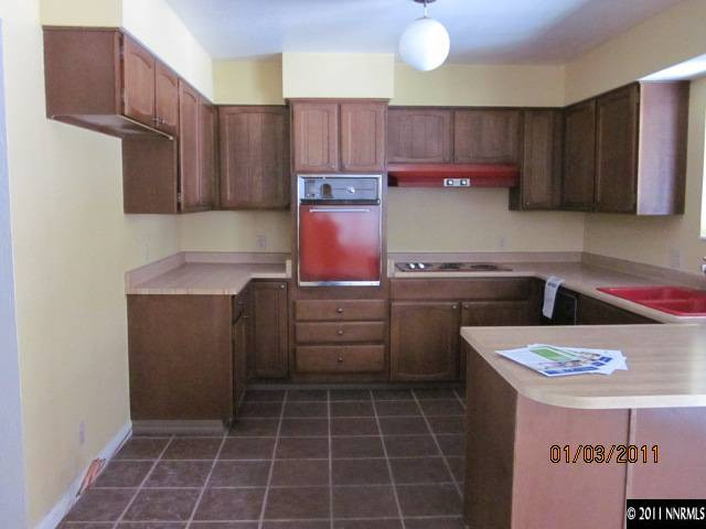 2090 Keystone Avenue Reno, NV 89503 - Photo 4 of 10 a kitchen with a sink a stove and cabinets