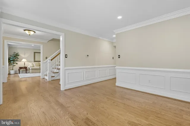 a kitchen with stainless steel appliances kitchen island granite countertop a table and chairs in it