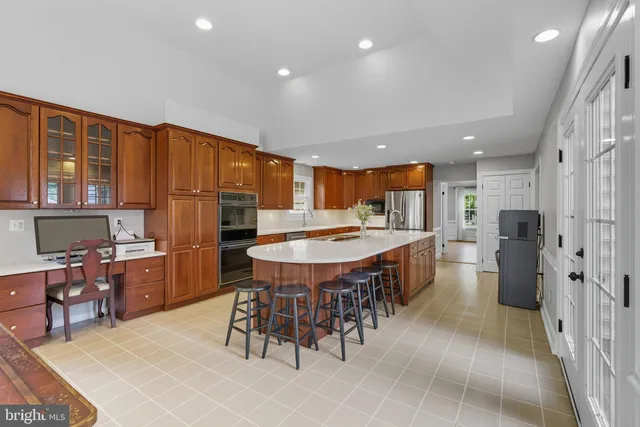 a view of a house with a yard and a garage