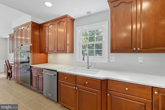 a view of a deck with a large trees with wooden fence