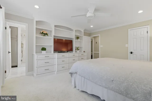 a bathroom with a bathtub shower sink vanity and toilet