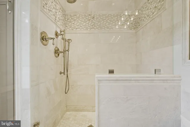 a spacious bathroom with a granite countertop sink a toilet and a mirror