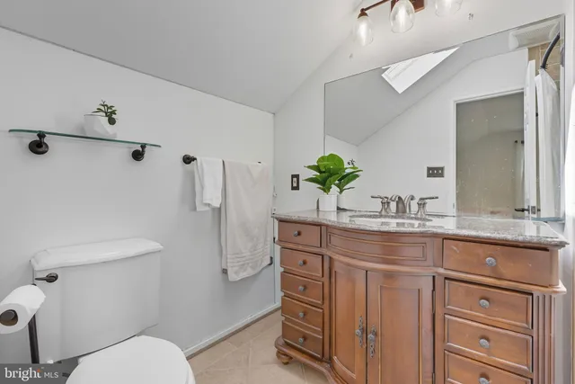 a picture of a bench in front of a wall