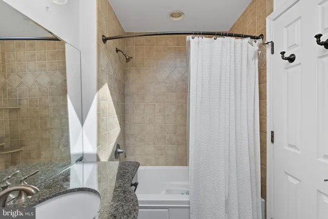 a view of a big yard in front of a brick house