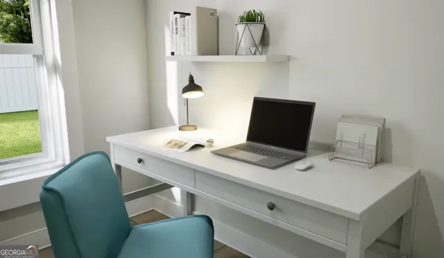 a view of table and chairs in room