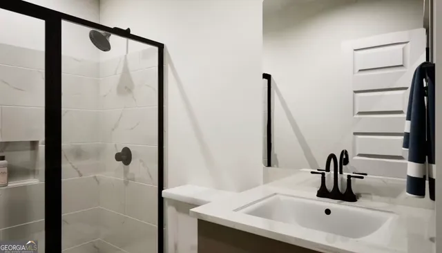a bathroom with a sink and mirror