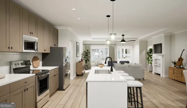 a kitchen with stainless steel appliances kitchen island a sink a stove a refrigerator cabinets and chairs