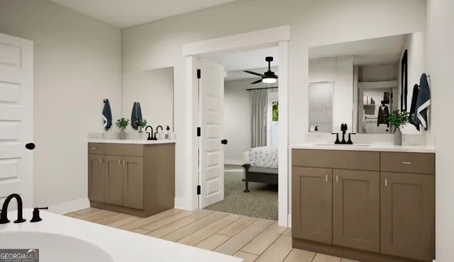 a en suite bathroom with a double vanity sink a mirror and shower