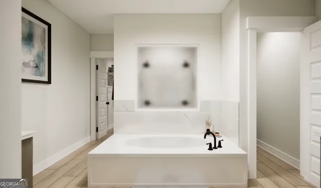 a bathroom with a bathtub and shower