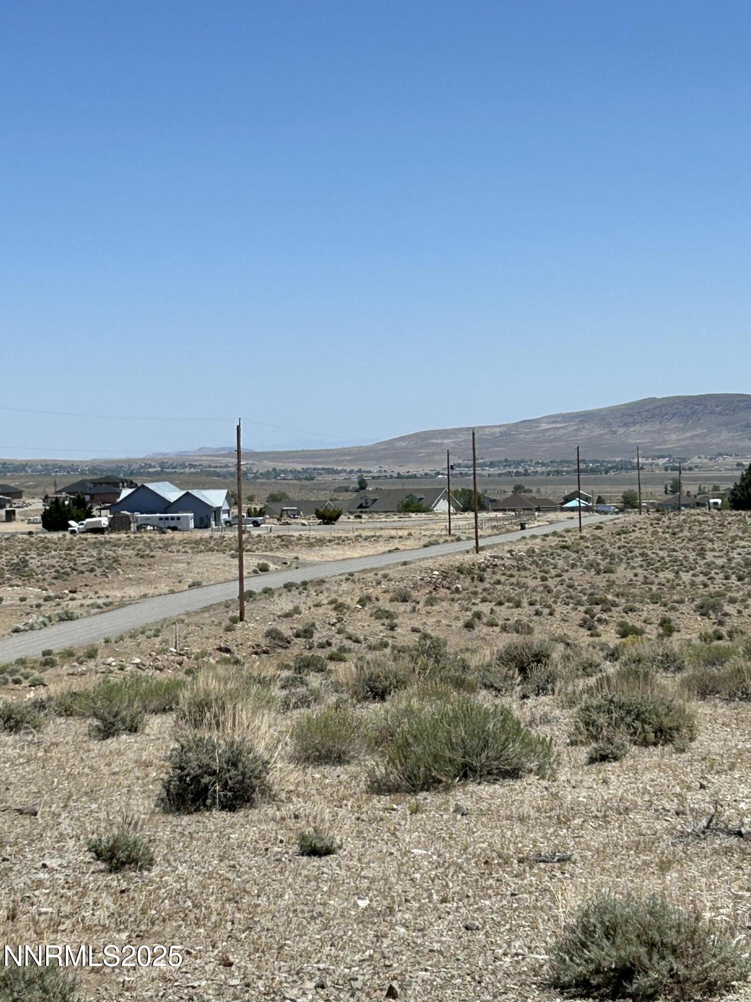 13595 Seneca Road Stagecoach, NV 89429 - Photo 2 of 15 a view of a dry yard with wooden fence