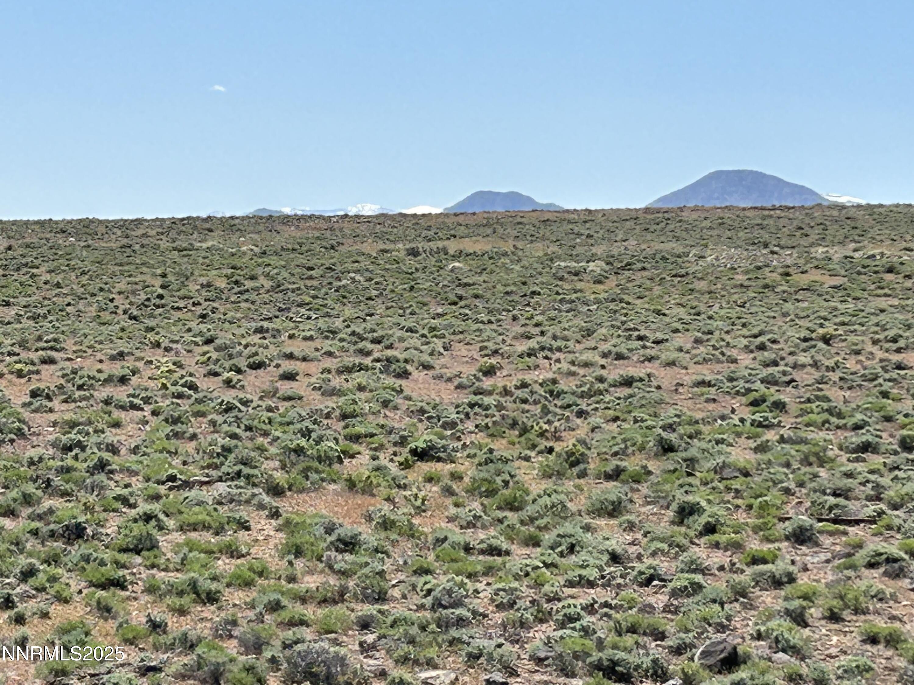 13595 Seneca Road Stagecoach, NV 89429 - Photo 4 of 15 a view of an ocean beach and mountain