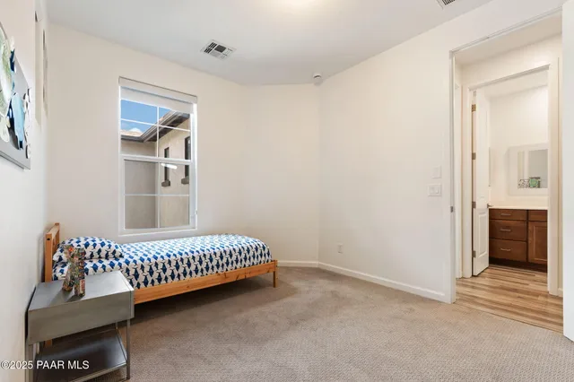 a view of a bedroom with furniture and staircase