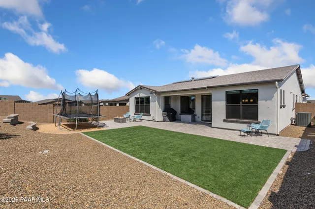 a view of a backyard with sitting area