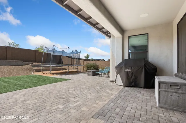 a view of a backyard of a house