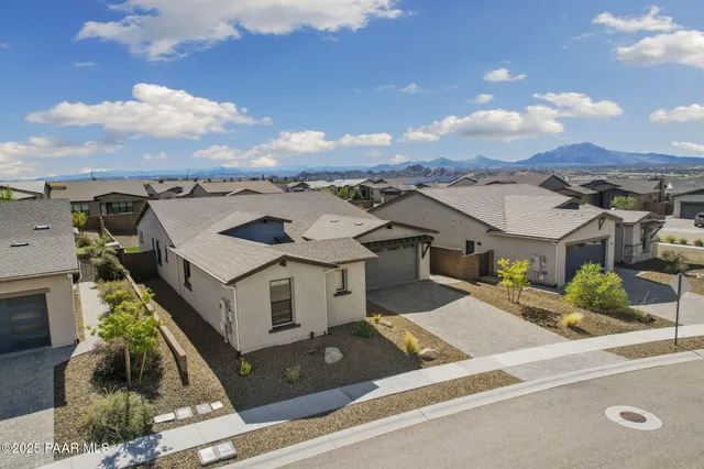 an aerial view of residential building with ocean view