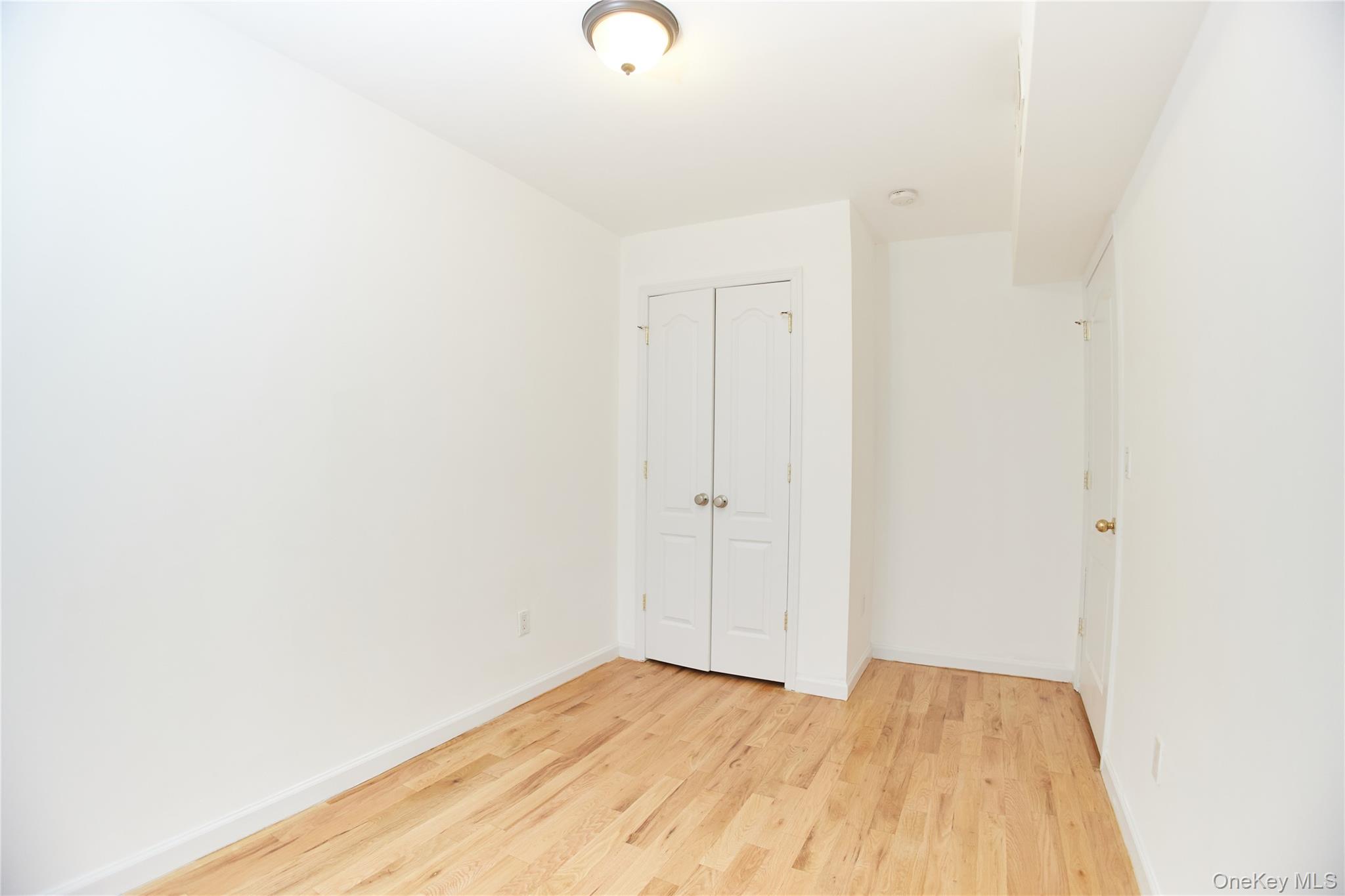 1292 Saint Marks Avenue, Unit 2 Brooklyn, NY 11213 - Photo 17 of 32 a view of a room with wooden floor