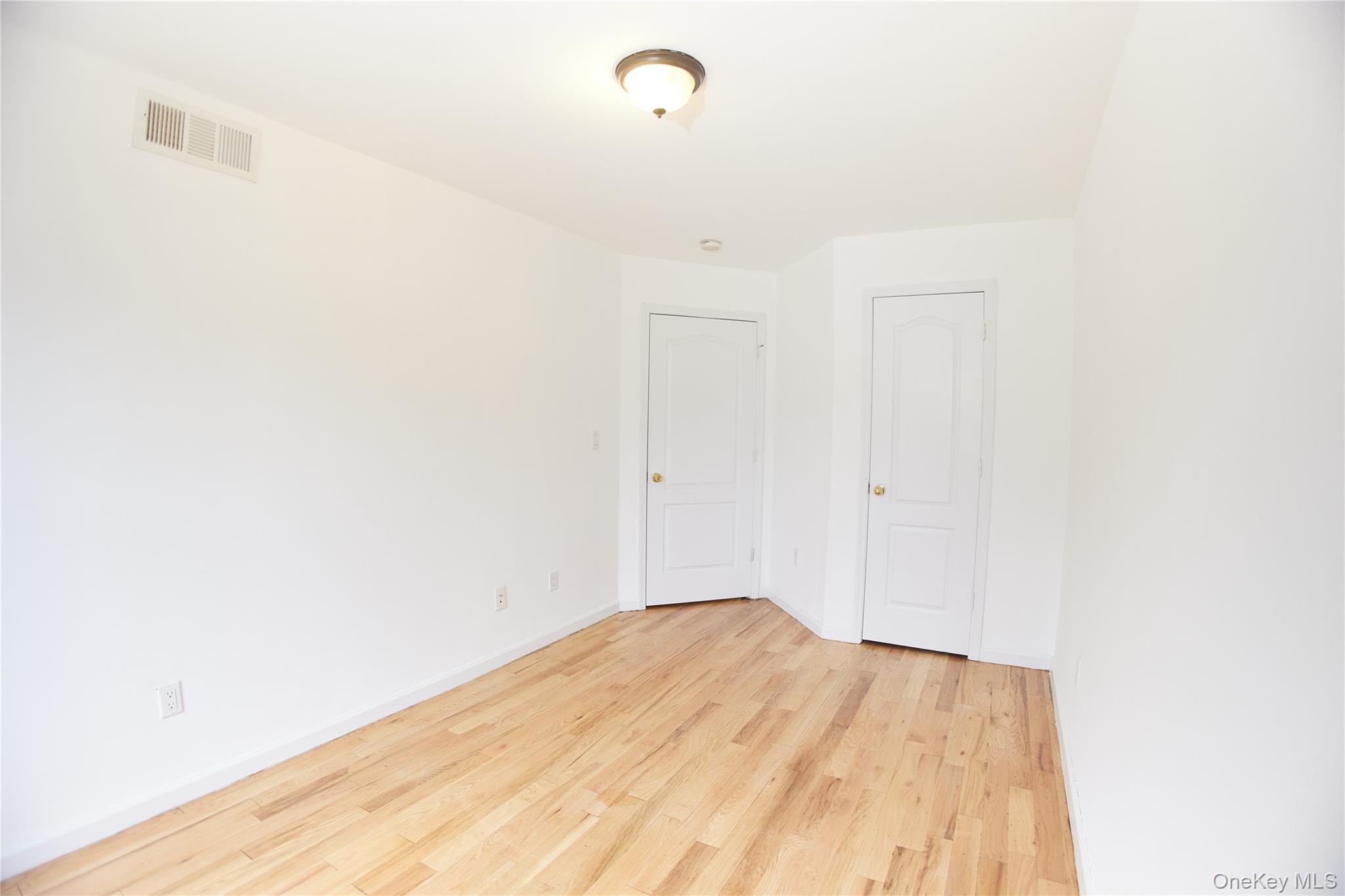 1292 Saint Marks Avenue, Unit 2 Brooklyn, NY 11213 - Photo 21 of 32 a view of a room with wooden floor
