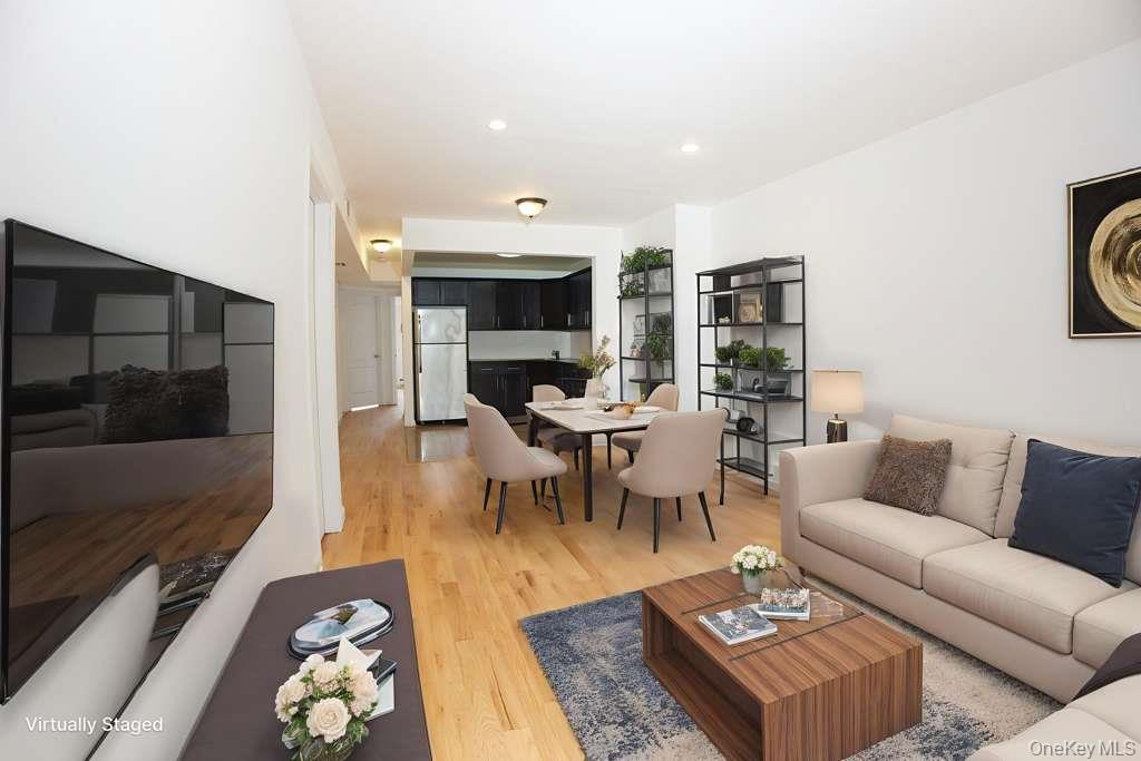 1292 Saint Marks Avenue, Unit 2 Brooklyn, NY 11213 - Photo 3 of 32 a living room with furniture and a flat screen tv