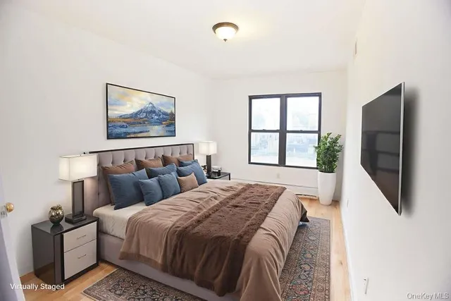 a bedroom with double bed and a window