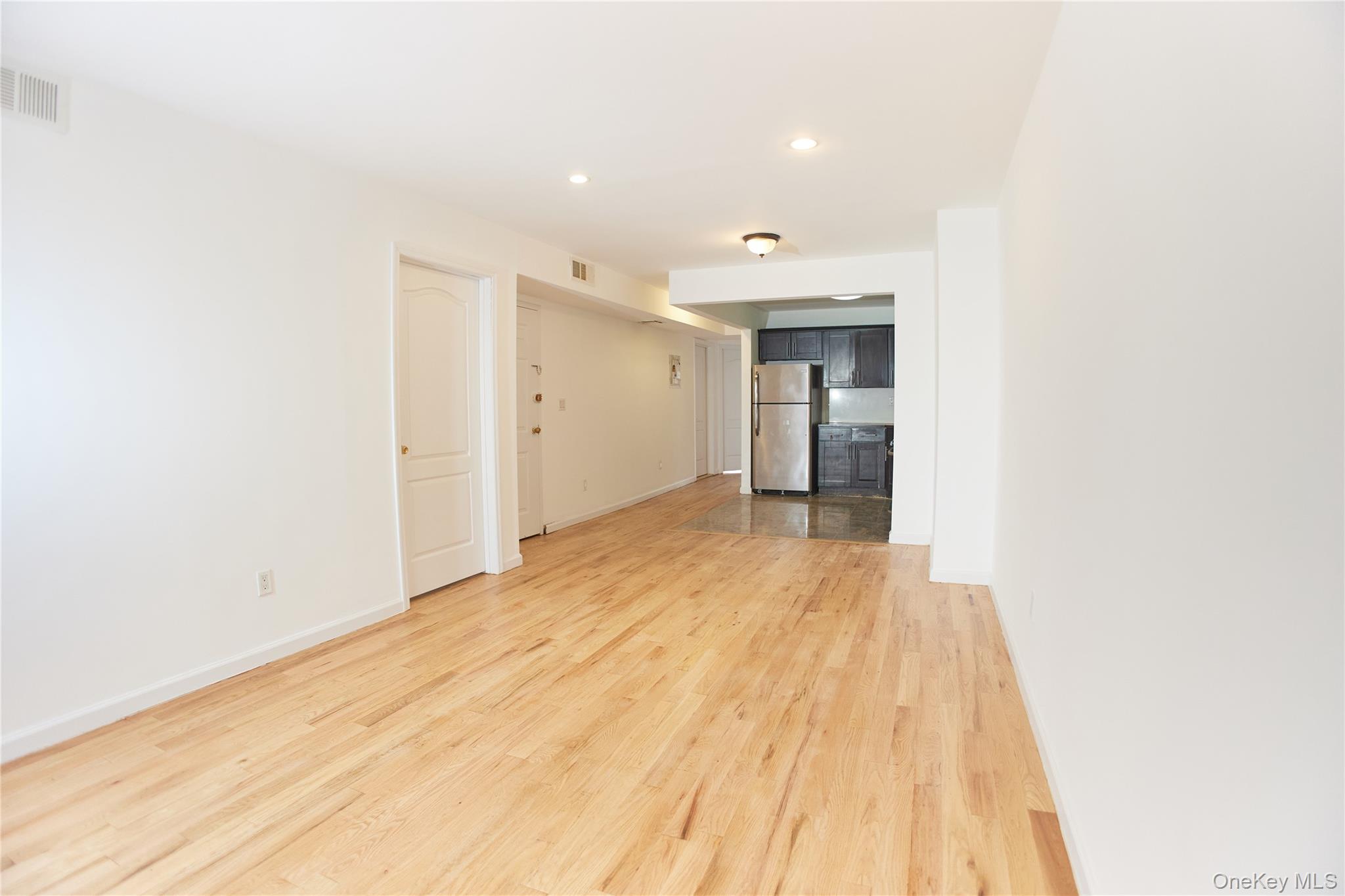 1292 Saint Marks Avenue, Unit 2 Brooklyn, NY 11213 - Photo 7 of 32 a view of an empty room and wooden floor