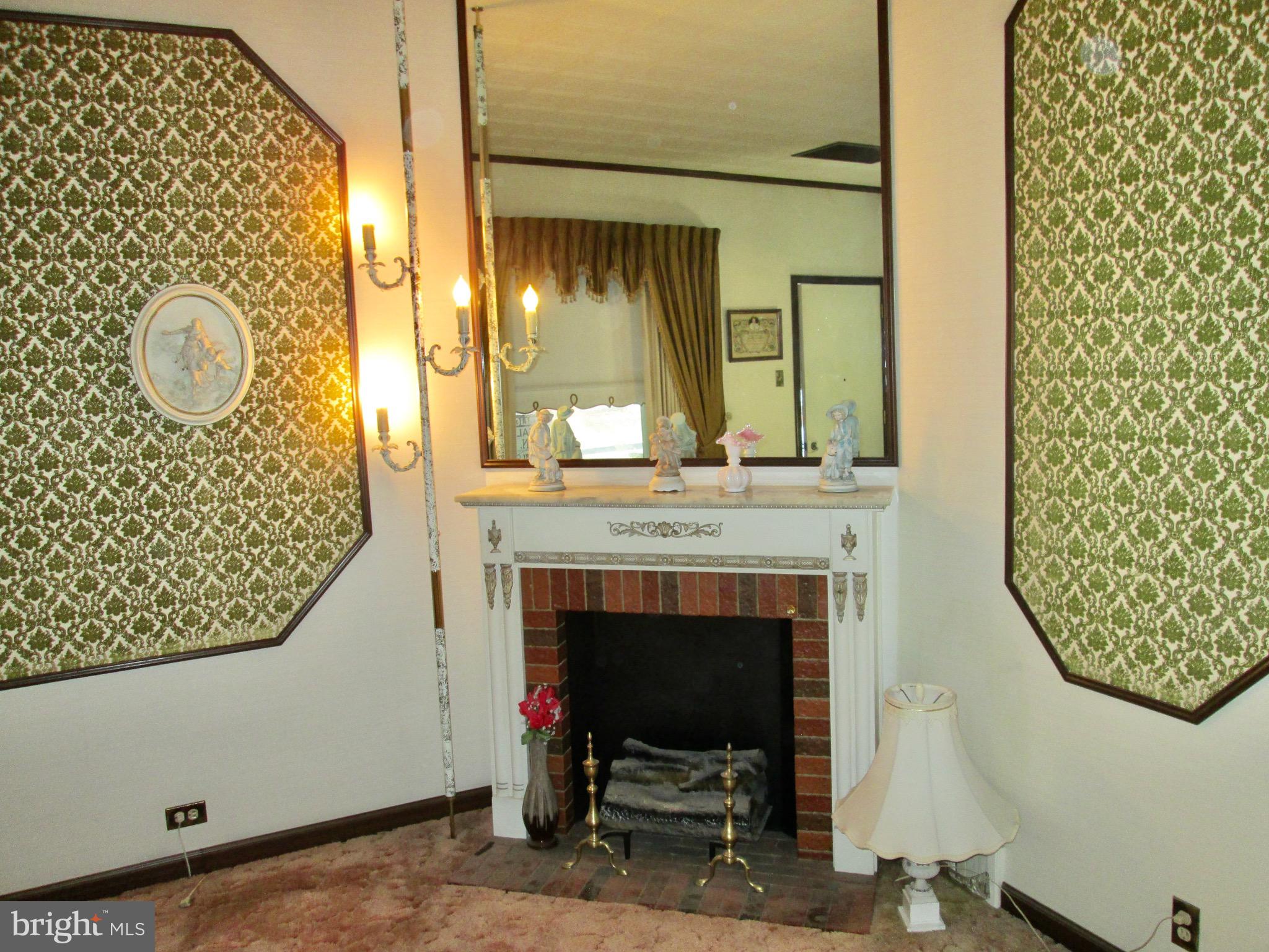 1043 Walnut Street Reading, PA 19601 - Photo 11 of 32 a view of a livingroom with furniture and a fireplace