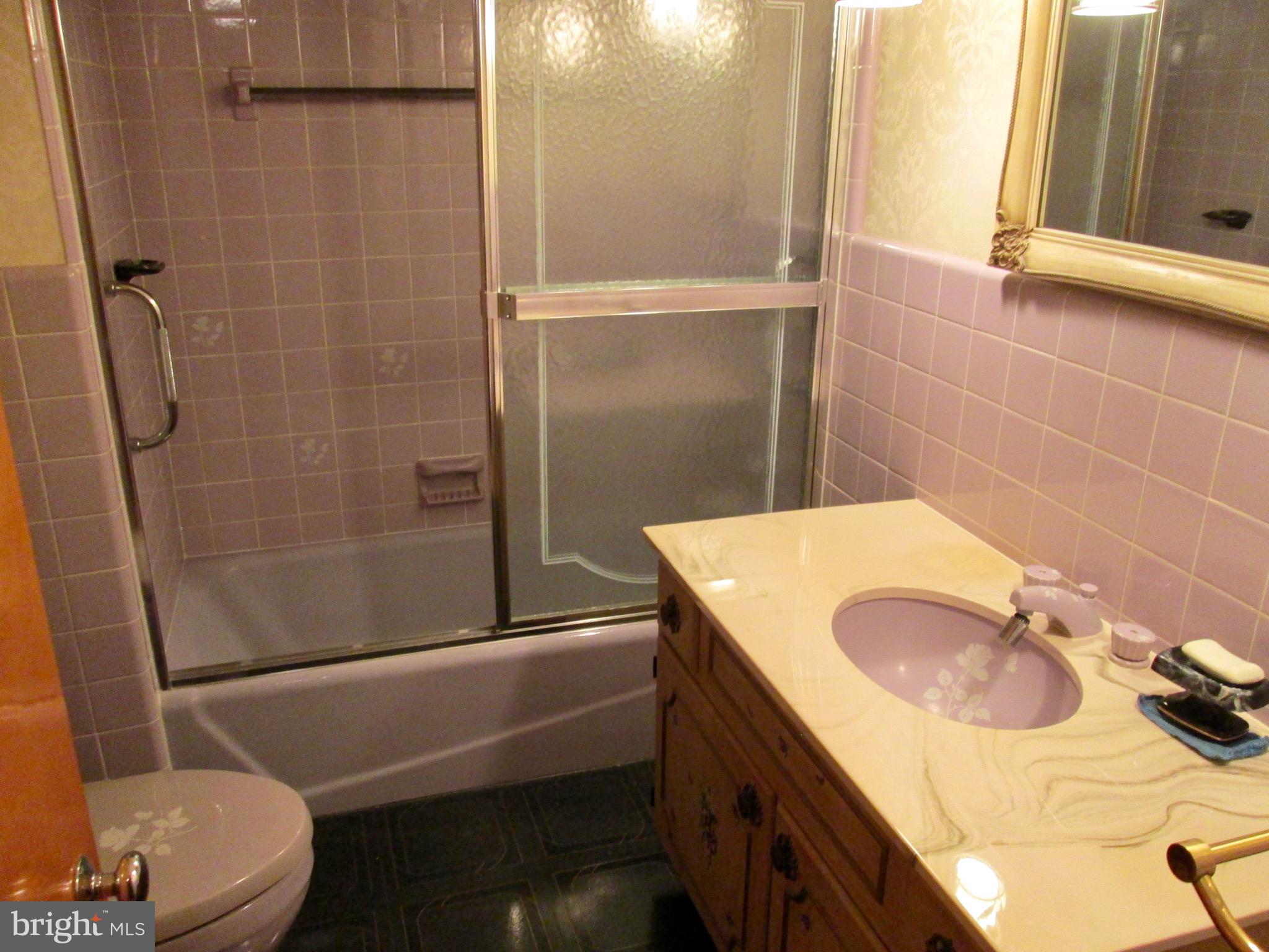 1043 Walnut Street Reading, PA 19601 - Photo 15 of 32 a bathroom with a sink toilet and shower