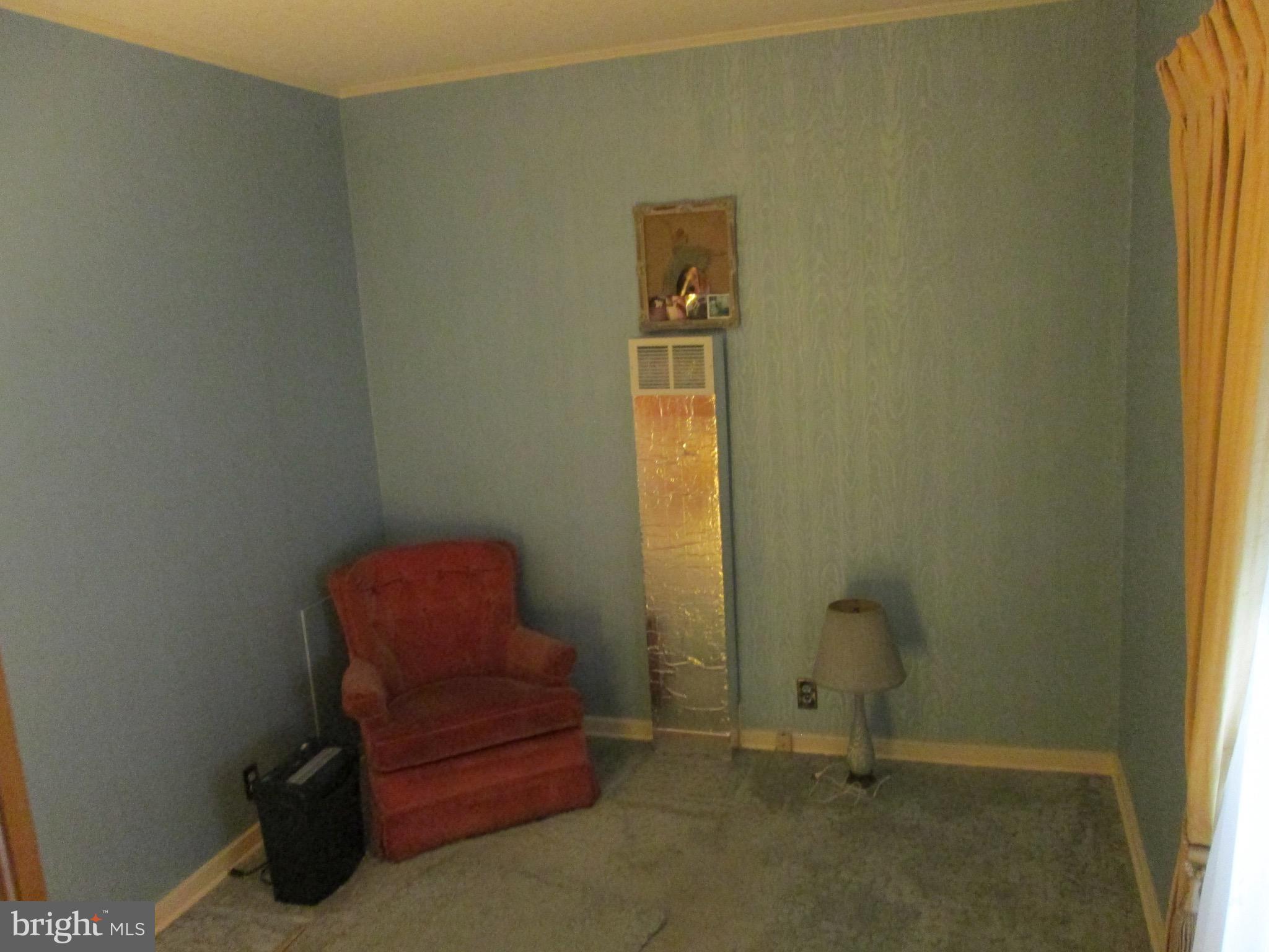 1043 Walnut Street Reading, PA 19601 - Photo 16 of 32 a room with a chair and a window