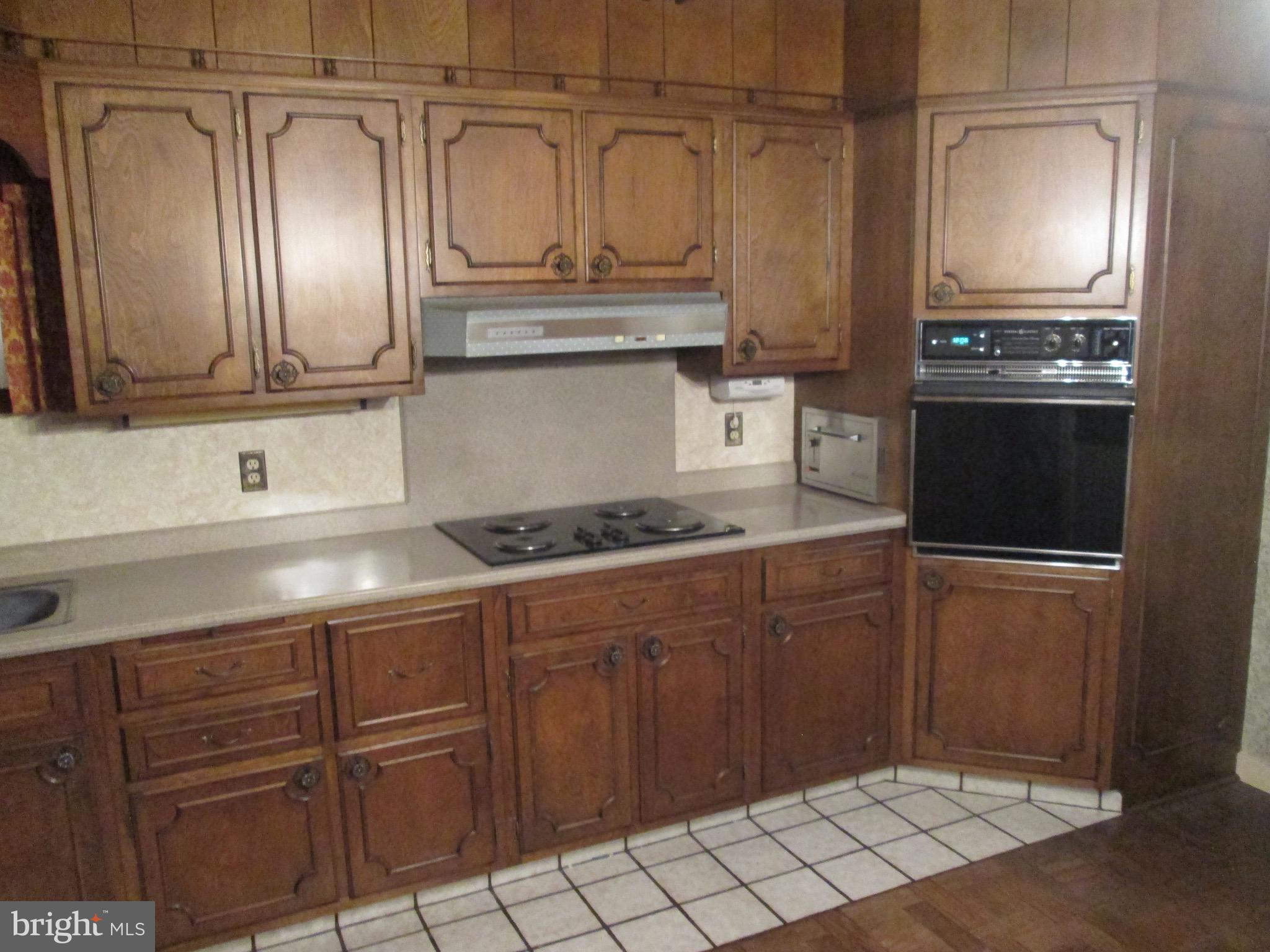 1043 Walnut Street Reading, PA 19601 - Photo 4 of 32 a kitchen with stainless steel appliances granite countertop a sink and cabinets