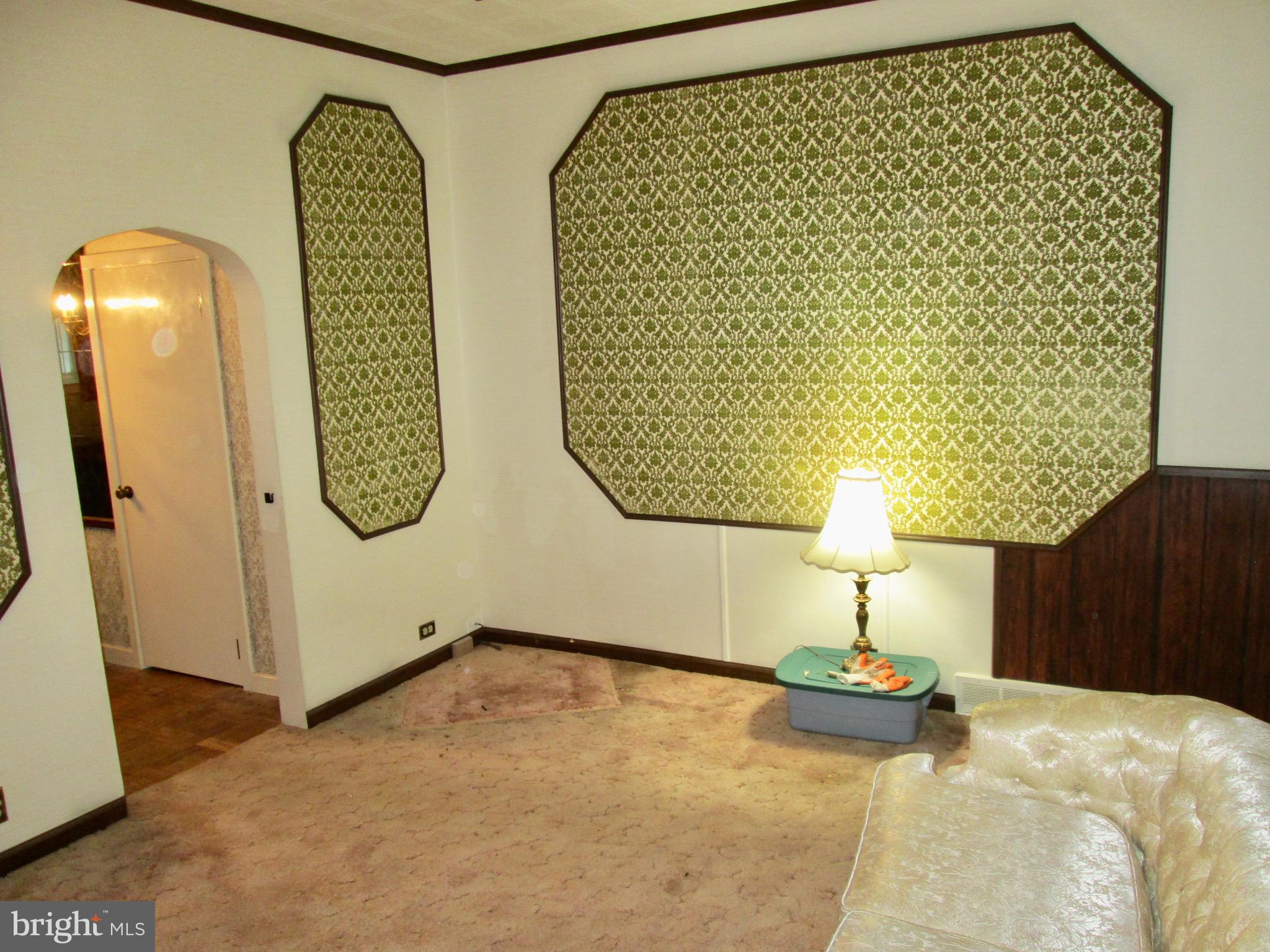 1043 Walnut Street Reading, PA 19601 - Photo 10 of 32 a bed room with a bed and a table