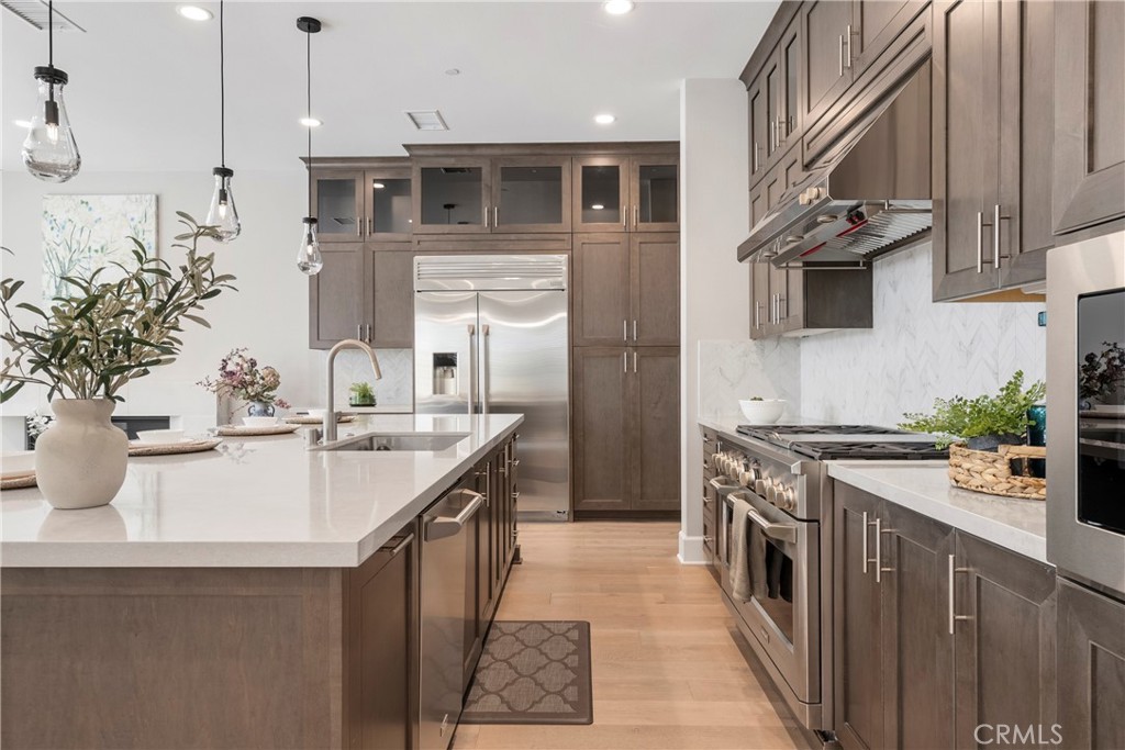 84 Rockinghorse Irvine, CA 92602 - Photo 15 of 63 a kitchen with stainless steel appliances granite countertop a sink a stove and a refrigerator