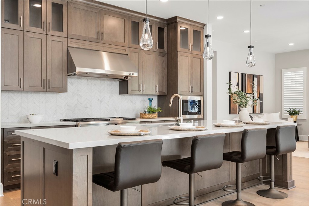 84 Rockinghorse Irvine, CA 92602 - Photo 19 of 63 a kitchen with stainless steel appliances a sink and cabinets