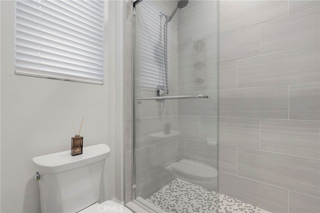 84 Rockinghorse Irvine, CA 92602 - Photo 29 of 63 a bathroom with a shower a toilet and sink